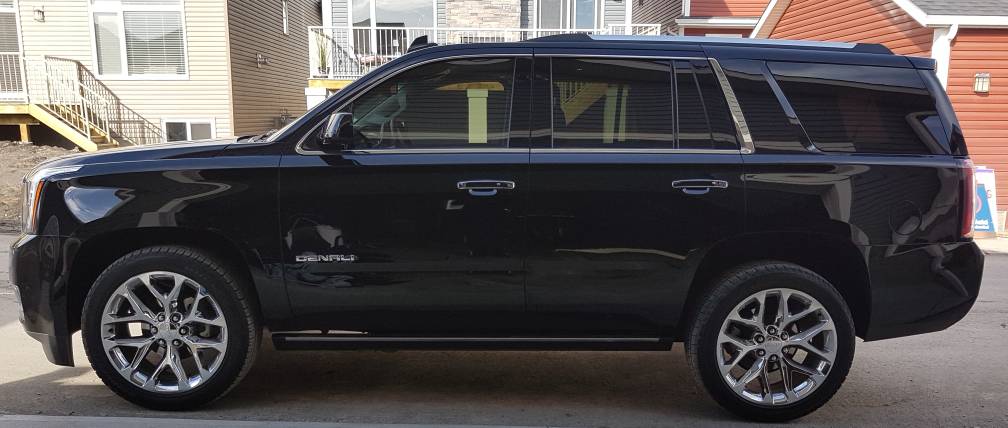 A GMC Yukon Denali with tinted windows in Ocala, Florida.